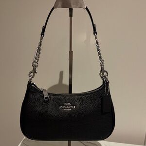 Black and silver coach Terri